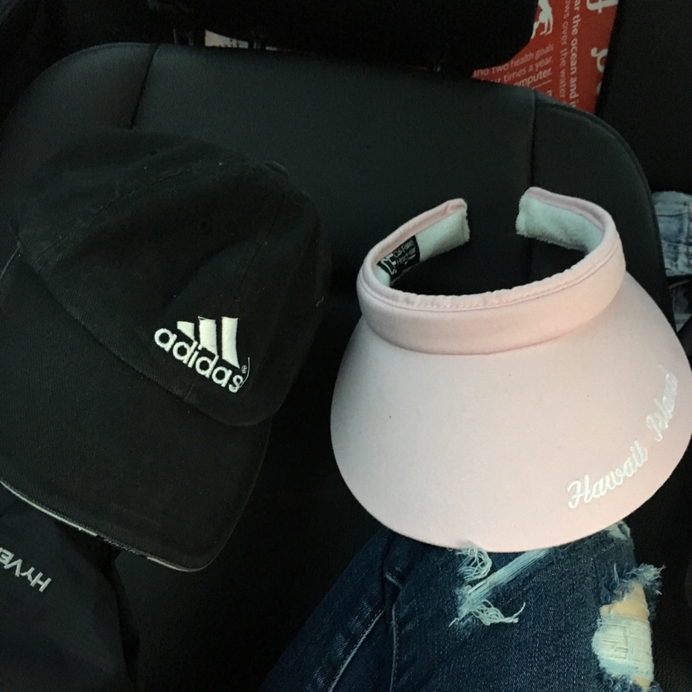 Pink Hawaiian visor and black adidas baseball cap